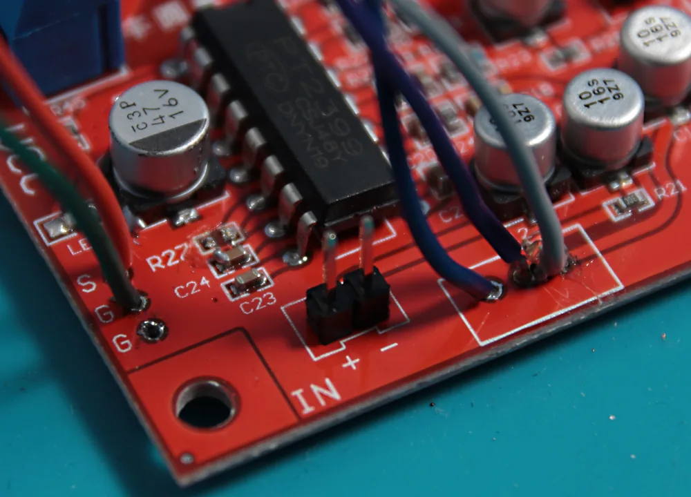 Breakout wires running from the board to the pots, with the removed R27 resistor sitting alongside.