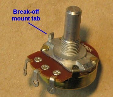 A regular-sized potentiometer with its break-off lock tab still attached.