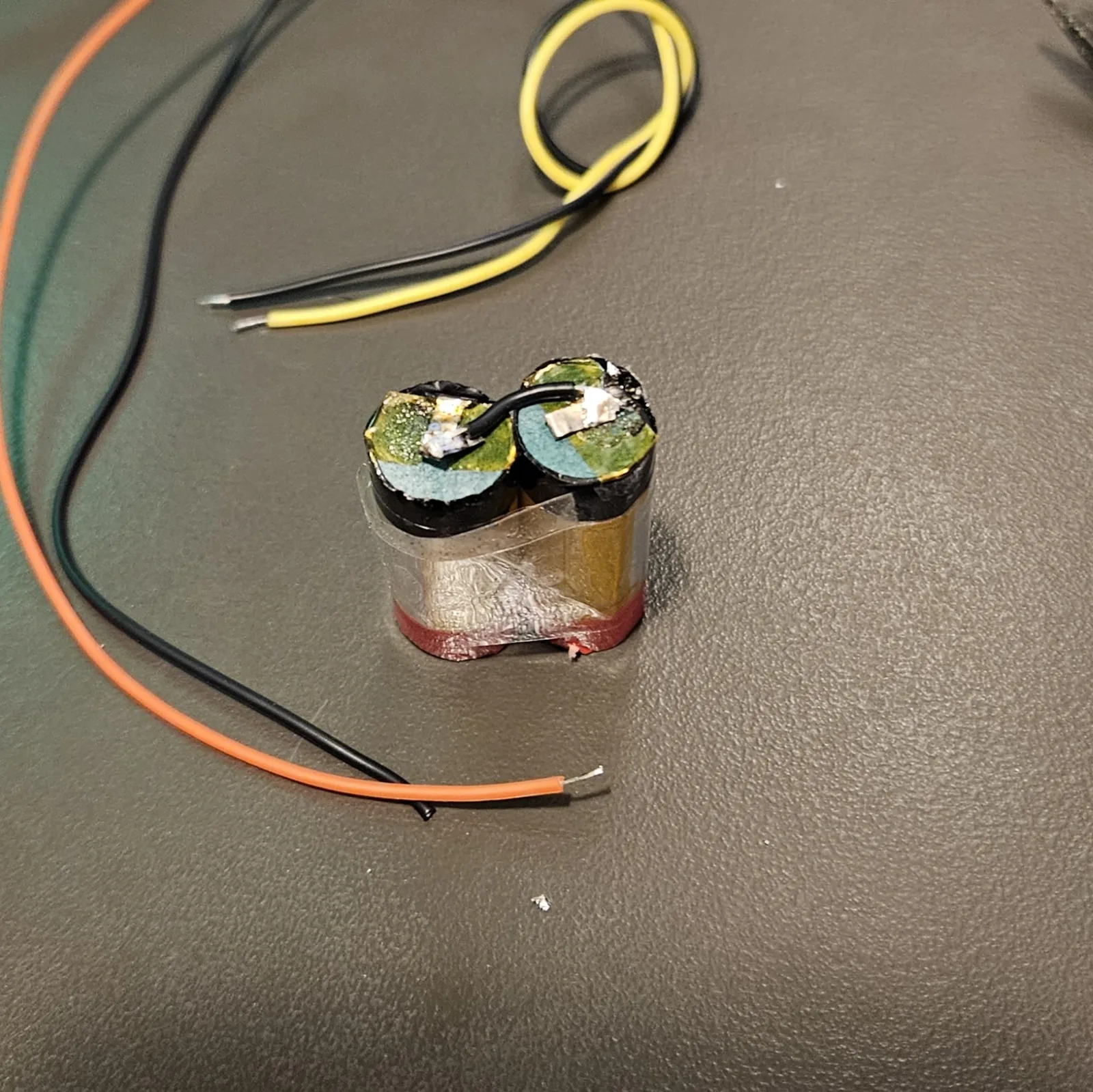 The two cells with the ground (negative) side fully wired together.