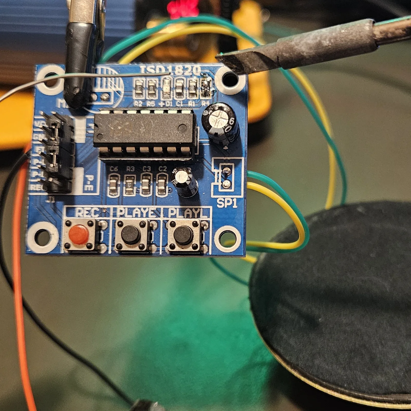 The top edge of the module after removal, with a visible gap in the row of surface-mount parts where the R4 resistor used to sit.