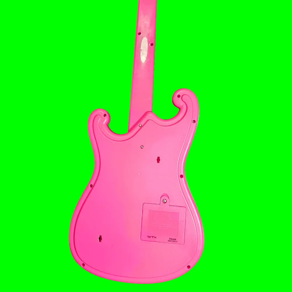 Back of the guitar: plain glossy pink moulded plastic with no added controls, a ring of assembly screws around the body edge and two keyhole-shaped hanging slots. A rectangular battery door with a single screw sits low on the body, and the moulded panel beside it is printed "Toys 'R' Us" with the codes "SF6269E" and "04012017".
