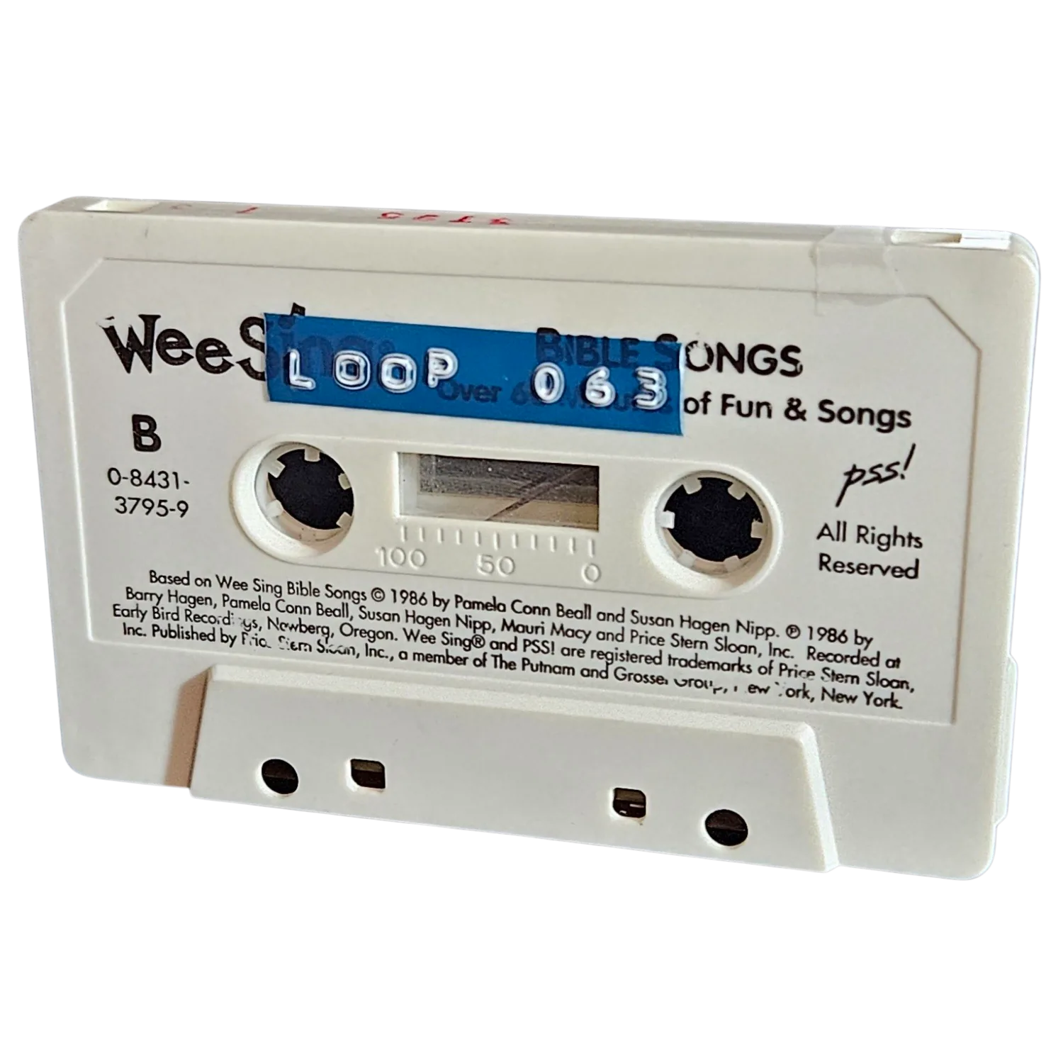 White cassette shell labeled Loop 063 on a blue strip, recycled from a 1986 Wee Sing Bible Songs cassette
